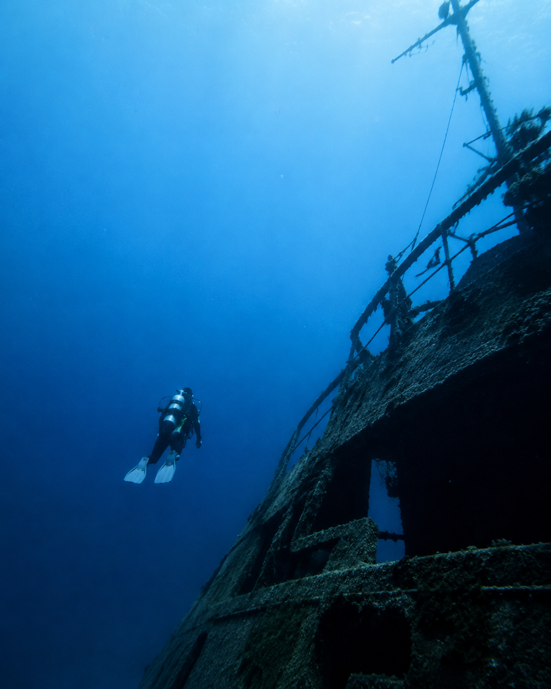 Scuba diver exploring a historic shipwreck